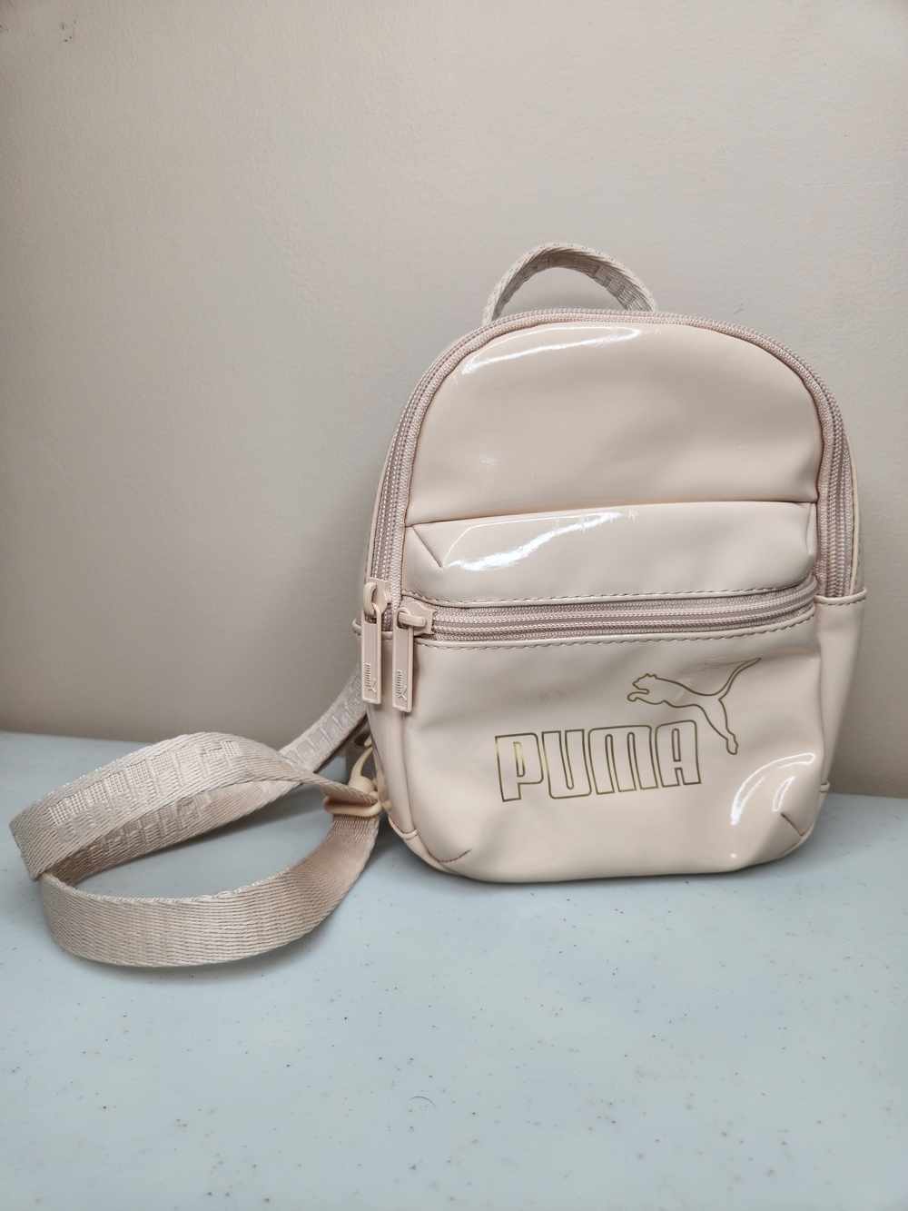 PUMA Mini Backpack – Cream Patent Crossbody